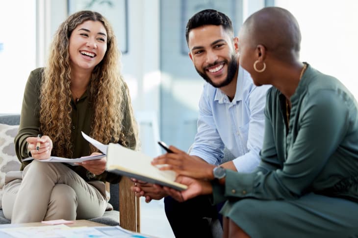 Three people in a discussion