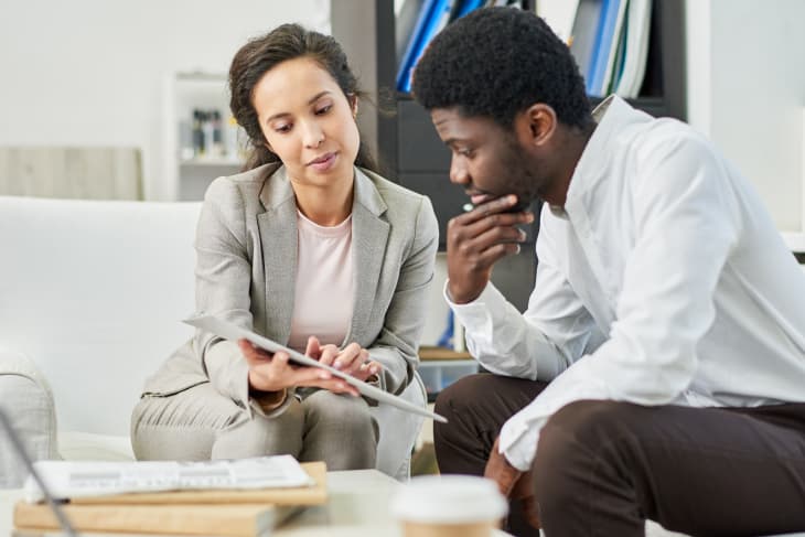 Two co-workers reviewing data