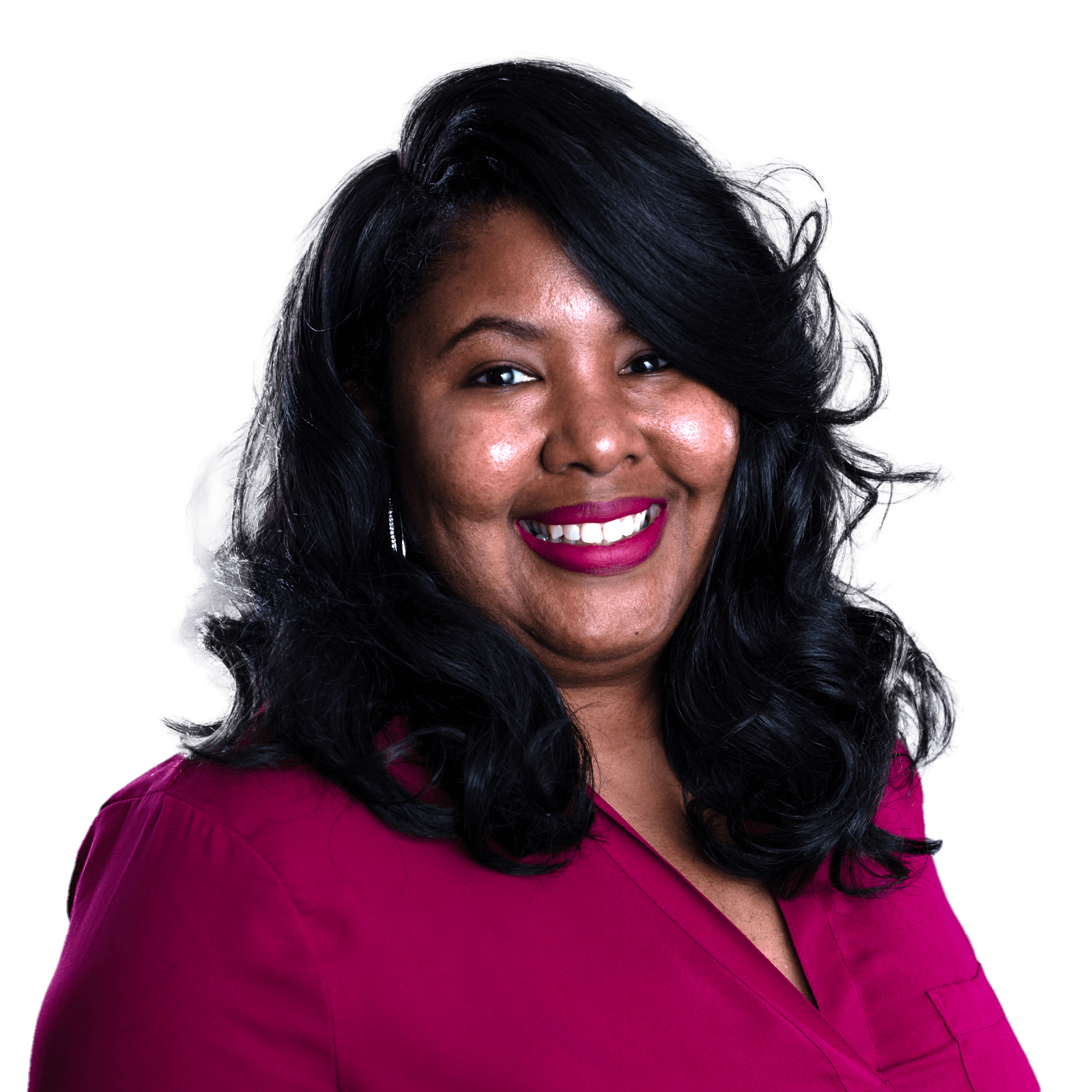 A woman with dark wavy hair in a dark pink dress shirt smiles that the camera.