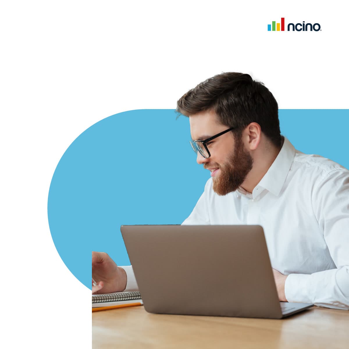 Man Beard Glasses Laptop Blue uses customer onboarding software- Newsroom Stock Image