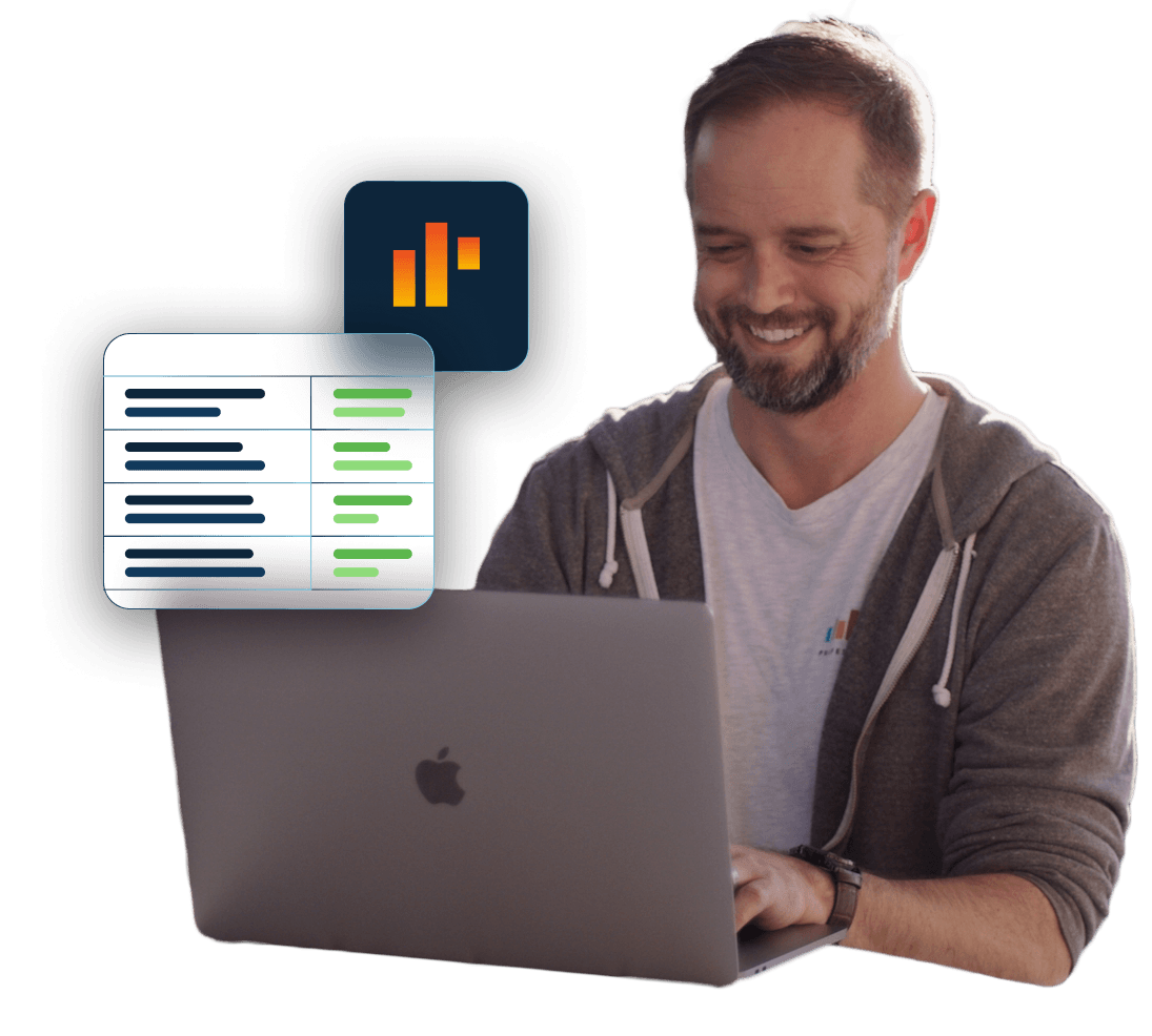 A man with a beard on a laptop smiles as HUD items float near him.